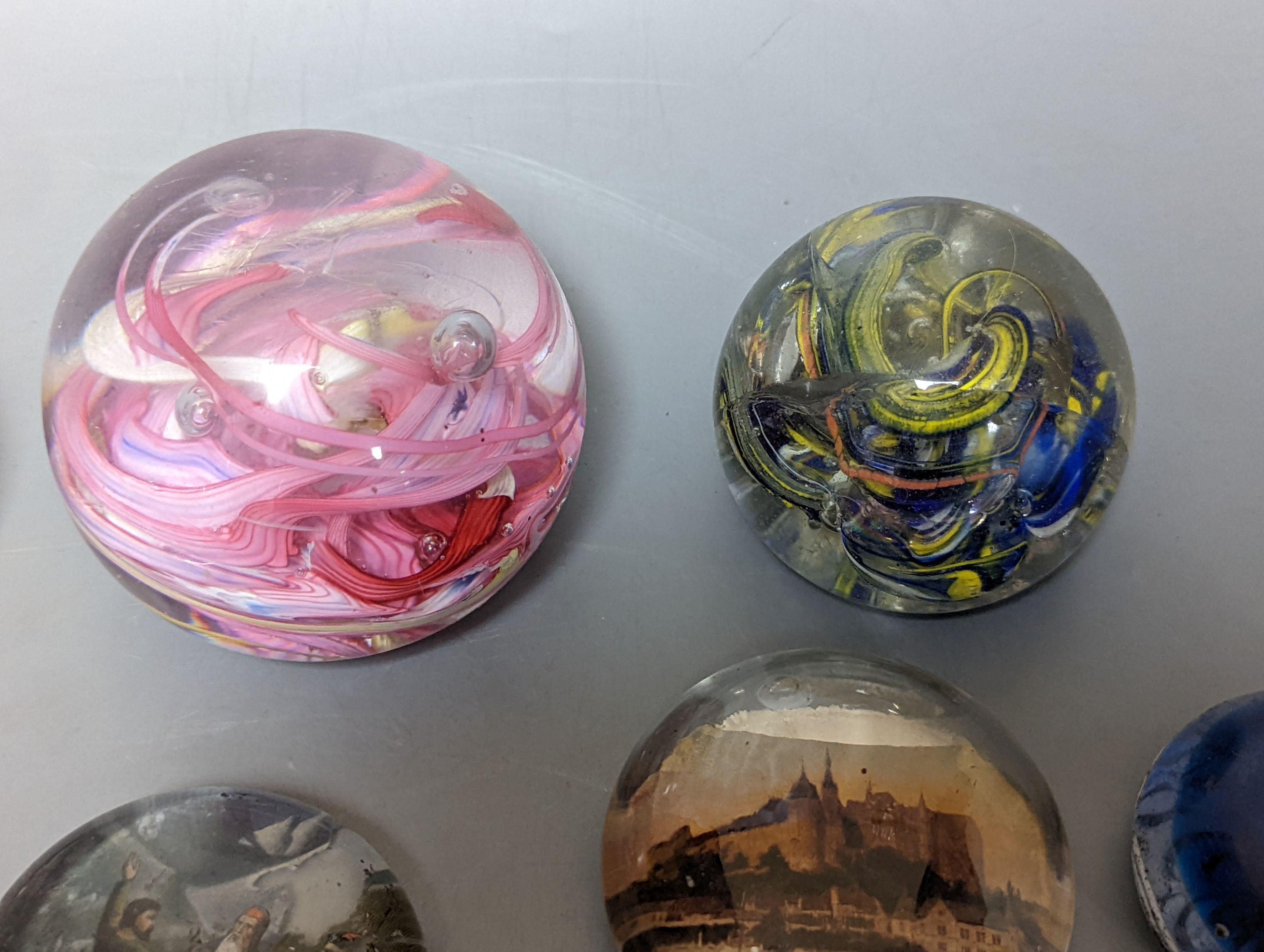 Nine various glass paperweights